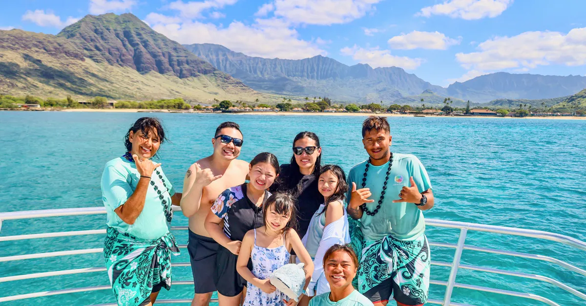 Catamaran with a water slide anchored for snorkeling on an Oahu dolphin tour from Waianae Small Boat Harbor, Hawaii